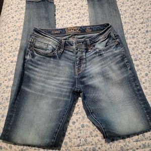 Buckle black skinny jeans